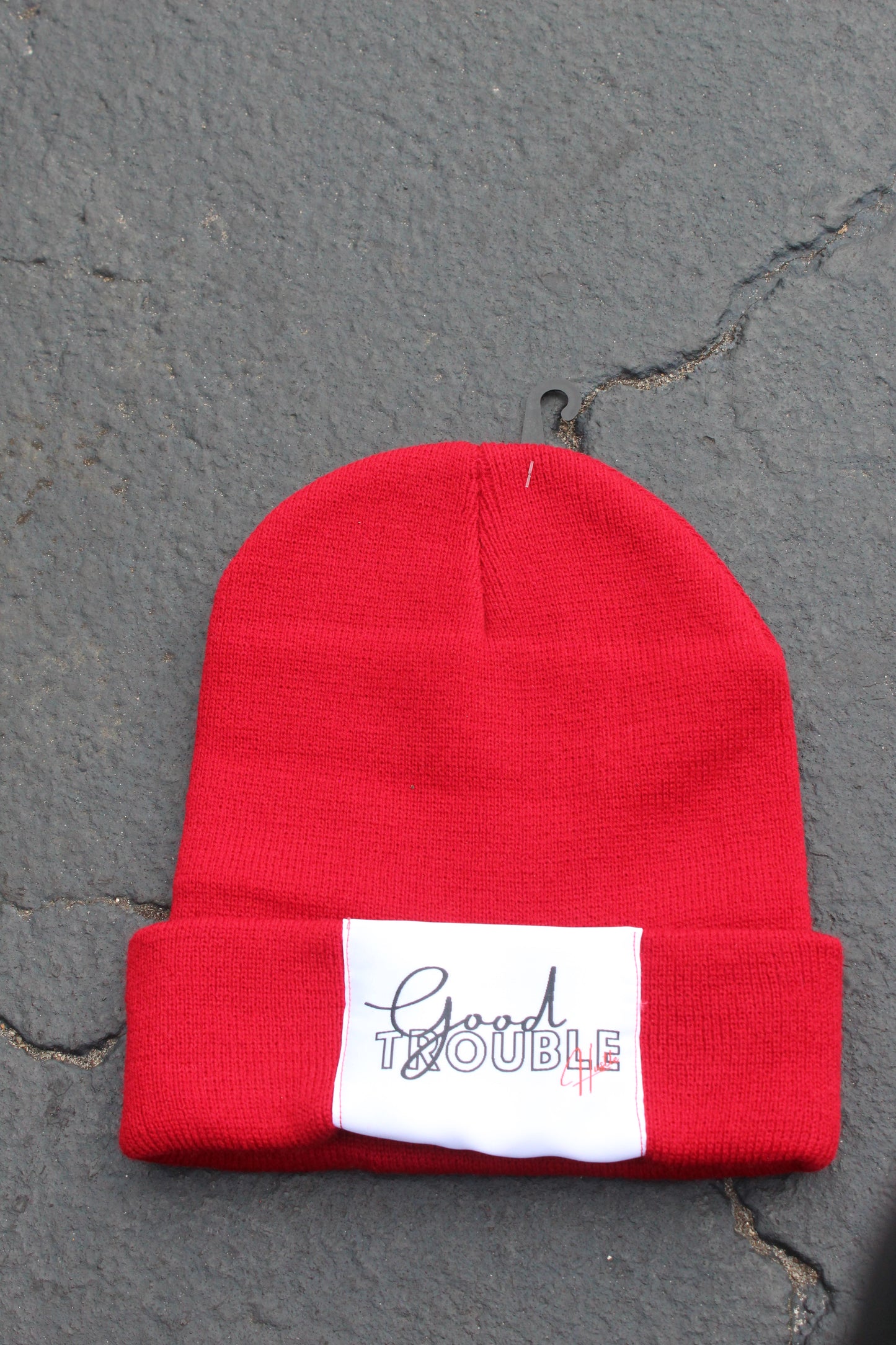 Red beanie with Good Trouble hustle Logo